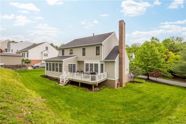 3001 Willowbrook Dr, South Fayette, PA 15017 - rear view of house featuring a deck, a chimney, a yard, roof with shingles, and a sunroom