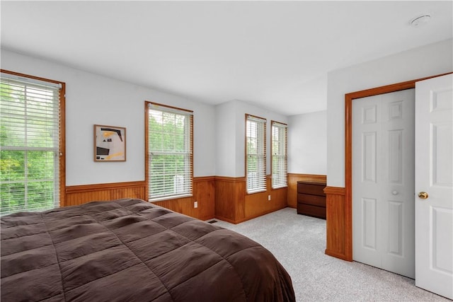 3001 Willowbrook Dr, South Fayette, PA 15017 - bedroom with wainscoting, light carpet, and wooden walls