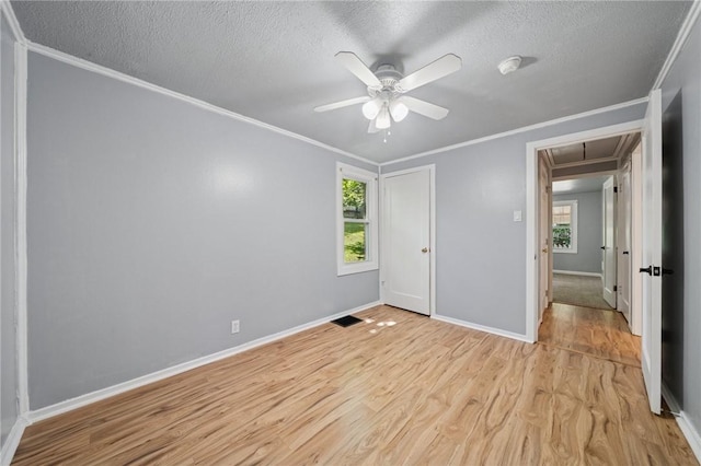 203 Clever Ave, Mckees Rocks, PA 15136 - unfurnished bedroom with attic access, ornamental molding, a textured ceiling, light wood-style floors, and a ceiling fan