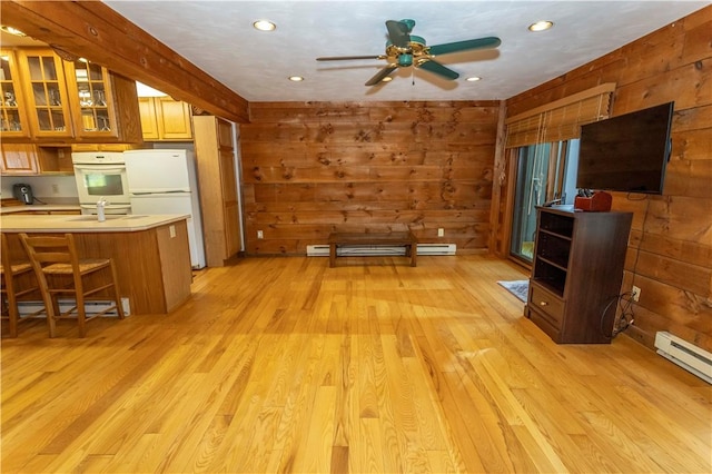 13 Lakeview Dr, Hidden Valley, PA 15502 - kitchen featuring white appliances, wood walls, light wood finished floors, light countertops, and a ceiling fan