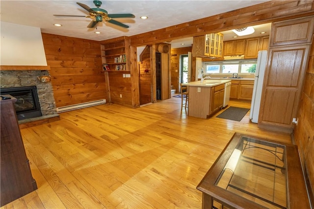 13 Lakeview Dr, Hidden Valley, PA 15502 - kitchen featuring baseboard heating, light countertops, white appliances, a ceiling fan, and a kitchen bar