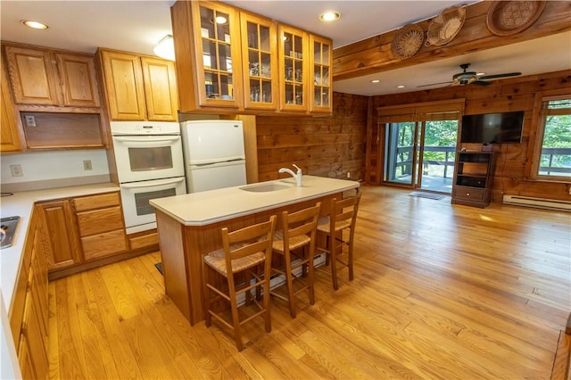 13 Lakeview Dr, Hidden Valley, PA 15502 - kitchen featuring white appliances, light wood-type flooring, wood walls, baseboard heating, and light countertops