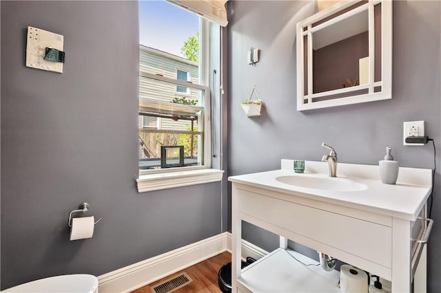 160 45th St, Lawrenceville, PA 15201 - bathroom featuring vanity and wood finished floors
