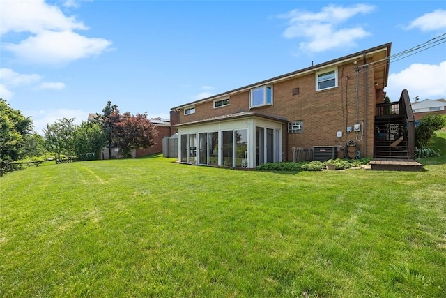 4715 Meadowgreen Dr, Whitehall, PA 15236 - rear view of property featuring a sunroom, stairs, a lawn, and brick siding