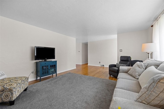 4715 Meadowgreen Dr, Whitehall, PA 15236 - living room with wood finished floors and baseboards