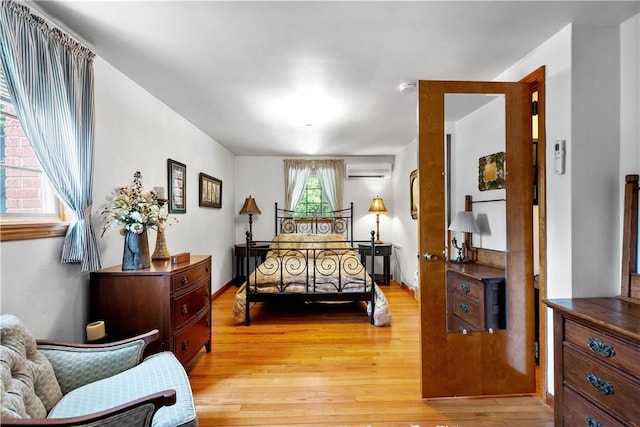 6826 Church Ave, Ben Avon, PA 15202 - bedroom featuring light wood-style flooring and an AC wall unit