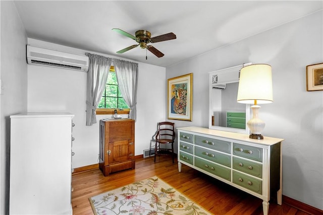 6826 Church Ave, Ben Avon, PA 15202 - sitting room with a wall mounted AC, a ceiling fan, and wood finished floors