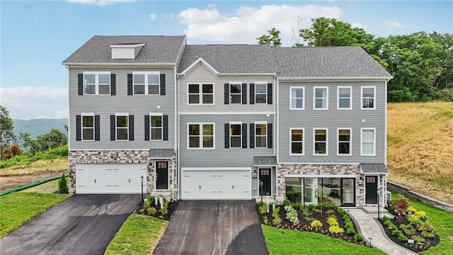 116 River Ridge Drive, Moon/Crescent Twp, PA 15108 - view of front of house with stone siding, asphalt driveway, and a garage