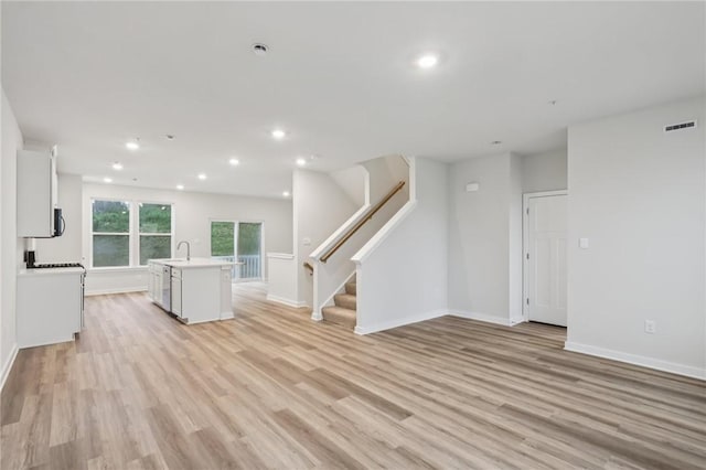 116 River Ridge Drive, Moon/Crescent Twp, PA 15108 - unfurnished living room with light wood-style floors, stairs, and recessed lighting