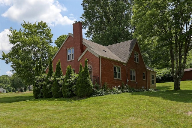 267 Blackhawk Rd, Chippewa Twp, PA 15010 - view of side of home featuring a chimney, brick siding, a lawn, and roof with shingles