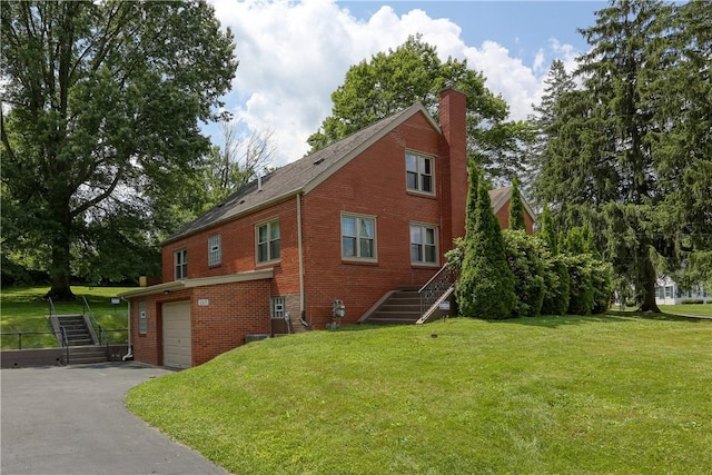 267 Blackhawk Rd, Chippewa Twp, PA 15010 - view of side of property with stairway, an attached garage, a chimney, and brick siding