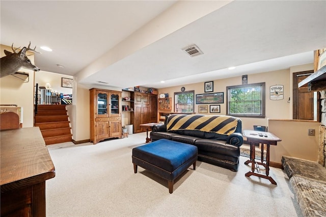 128 Honey Suckle Ln, Unity Twp, PA 15601 - carpeted living area featuring stairway and recessed lighting