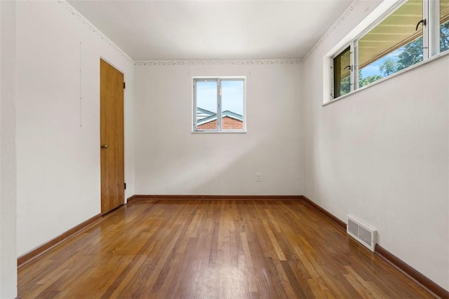 809 Sleepy Hollow Rd, Castle Shannon, PA 15234 - empty room with healthy amount of natural light and wood-type flooring