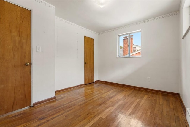 809 Sleepy Hollow Rd, Castle Shannon, PA 15234 - empty room with wood-type flooring and a baseboard heating unit