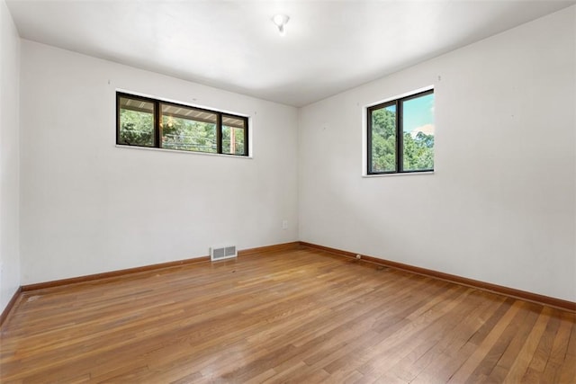 809 Sleepy Hollow Rd, Castle Shannon, PA 15234 - unfurnished room featuring plenty of natural light and light wood-style floors