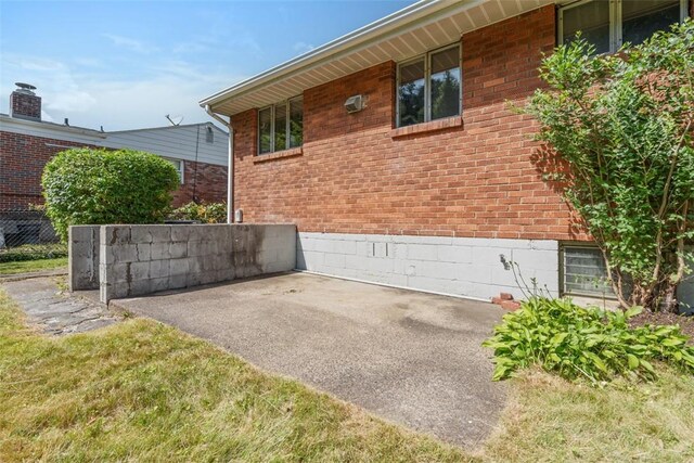 809 Sleepy Hollow Rd, Castle Shannon, PA 15234 - view of home's exterior with a patio and brick siding