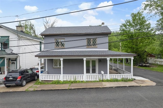 146 Mill St, Penn Hills, PA 15147 - view of front of house with covered porch, stucco siding, a shingled roof, and a balcony