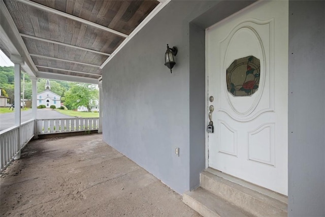 146 Mill St, Penn Hills, PA 15147 - view of exterior entry with a porch and stucco siding