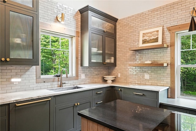 50 Hawes Rd, Wharton Twp, PA 15437 - kitchen featuring backsplash, glass insert cabinets, light stone countertops, gray cabinetry, and open shelves