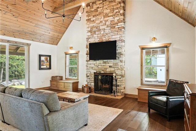 50 Hawes Rd, Wharton Twp, PA 15437 - living room featuring a wooden ceiling with exposed beams, high vaulted ceiling, a stone fireplace, and dark wood finished floors