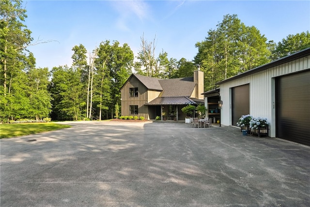 50 Hawes Rd, Wharton Twp, PA 15437 - view of front of property featuring a chimney and board and batten siding