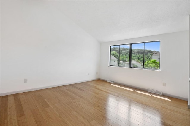 404 Beulah St, Shaler, PA 15209 - empty room featuring light wood-style flooring and lofted ceiling