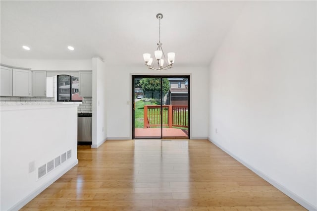 404 Beulah St, Shaler, PA 15209 - unfurnished dining area with a chandelier, light wood-style floors, and recessed lighting