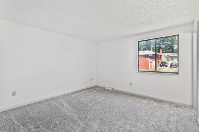 404 Beulah St, Shaler, PA 15209 - carpeted spare room with a textured ceiling and baseboards