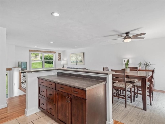 773 Somerville Dr, Saint Clair, PA 15243 - kitchen featuring dark countertops, a ceiling fan, recessed lighting, light wood-style floors, and open floor plan