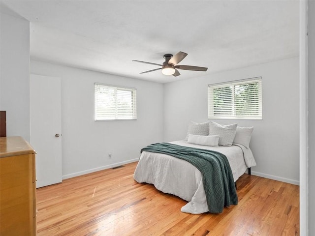 773 Somerville Dr, Saint Clair, PA 15243 - bedroom with multiple windows, light wood-style floors, and ceiling fan