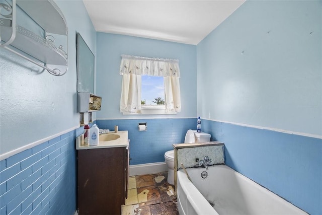 11839 Crockett St, North Huntingdon, PA 15647 - full bath featuring a bath, vanity, tile walls, and a wainscoted wall