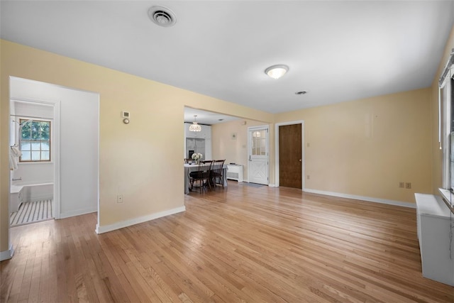 904-906 Blackburn Rd, Sewickley Heights, PA 15143 - unfurnished living room featuring baseboards and light wood-type flooring