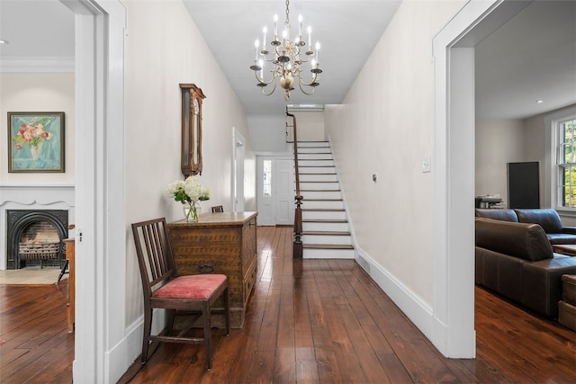 904-906 Blackburn Rd, Sewickley Heights, PA 15143 - entrance foyer featuring dark wood finished floors, a chandelier, stairway, and a fireplace with flush hearth