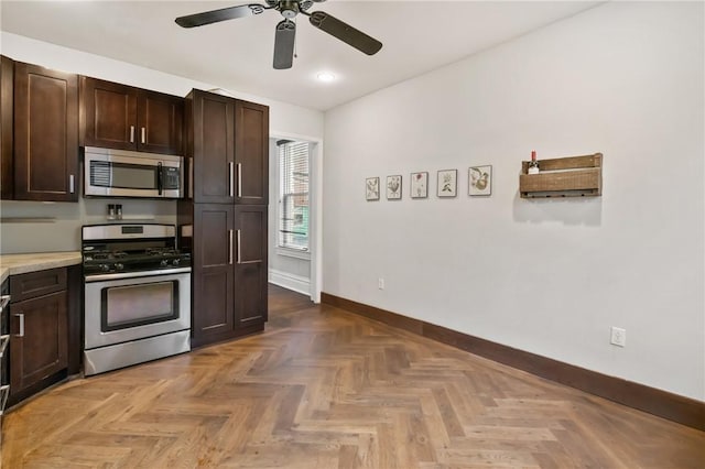 4034 Willow St, Lawrenceville, PA 15201 - kitchen featuring appliances with stainless steel finishes, dark brown cabinets, a ceiling fan, and light countertops