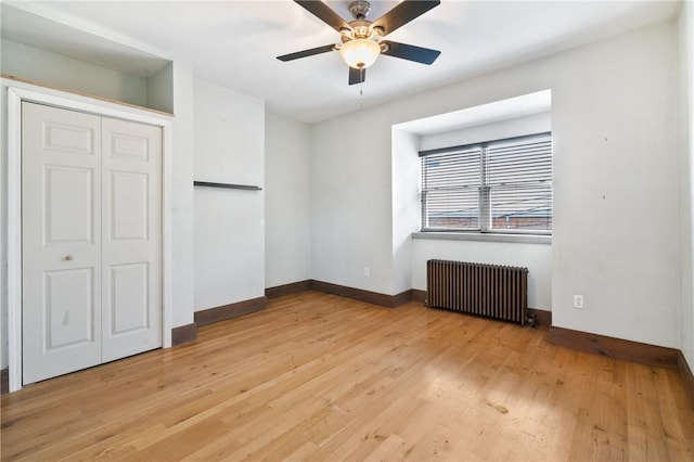 4034 Willow St, Lawrenceville, PA 15201 - unfurnished bedroom with radiator, light wood-type flooring, a ceiling fan, and a closet