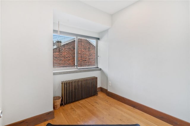4034 Willow St, Lawrenceville, PA 15201 - unfurnished room featuring radiator heating unit and wood finished floors