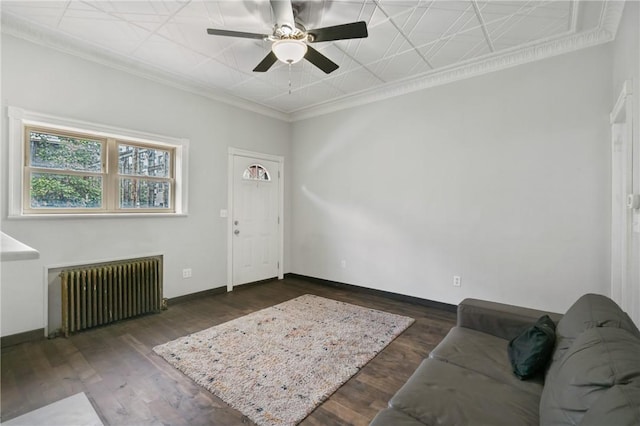 4034 Willow St, Lawrenceville, PA 15201 - living room with radiator heating unit, ceiling fan, ornamental molding, and dark wood-style floors