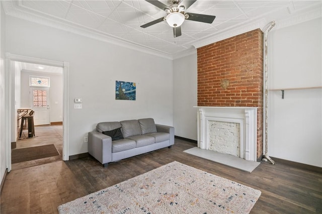 4034 Willow St, Lawrenceville, PA 15201 - living area with ceiling fan, wood finished floors, ornamental molding, a fireplace, and an ornate ceiling