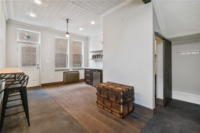 4034 Willow St, Lawrenceville, PA 15201 - kitchen with radiator heating unit, refrigerator, crown molding, a barn door, and hanging light fixtures