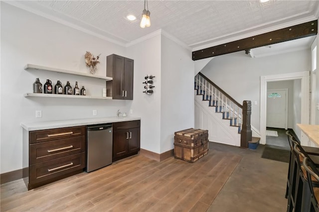 4034 Willow St, Lawrenceville, PA 15201 - indoor wet bar with stairs, dishwasher, crown molding, light wood finished floors, and hanging light fixtures