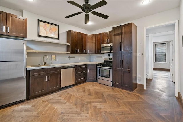 4034 Willow St, Lawrenceville, PA 15201 - kitchen with appliances with stainless steel finishes, open shelves, light countertops, dark brown cabinets, and a ceiling fan