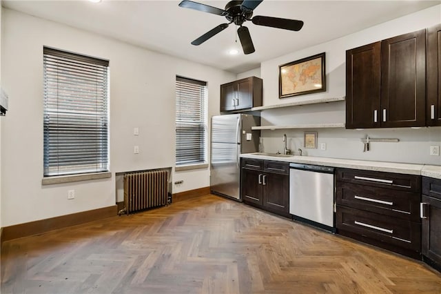 4034 Willow St, Lawrenceville, PA 15201 - kitchen featuring radiator heating unit, appliances with stainless steel finishes, recessed lighting, dark brown cabinets, and light countertops