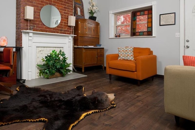 4034 Willow St, Lawrenceville, PA 15201 - sitting room with wood finished floors and a fireplace