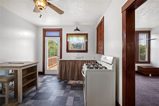 530 Franklin St, Freeport Boro, PA 16229 - kitchen featuring gas range gas stove, a textured ceiling, ceiling fan, light countertops, and brown cabinets