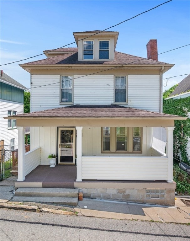 530 Franklin St, Freeport Boro, PA 16229 - american foursquare style home with a porch, roof with shingles, and a chimney