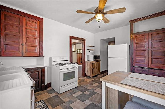 530 Franklin St, Freeport Boro, PA 16229 - kitchen with white appliances, ceiling fan, light countertops, and stone finish flooring