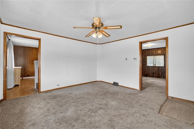 41 Taylor Ave, East Bethlehem, PA 15322 - unfurnished room featuring carpet flooring, ornamental molding, a ceiling fan, and wood walls