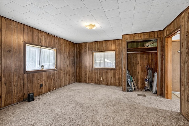 41 Taylor Ave, East Bethlehem, PA 15322 - unfurnished bedroom featuring carpet, wood walls, and a closet