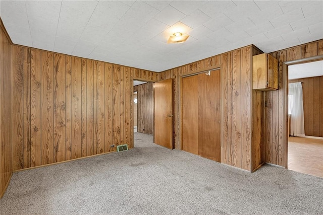 41 Taylor Ave, East Bethlehem, PA 15322 - spare room with wood walls and carpet