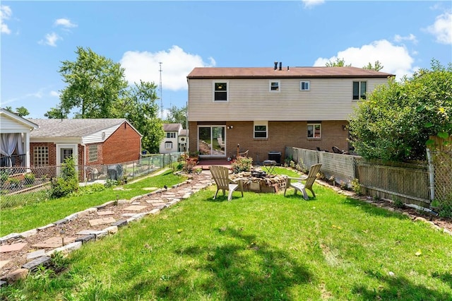 553 Indus St, Greenfield, PA 15207 - back of house with a fenced backyard, an outdoor fire pit, and brick siding